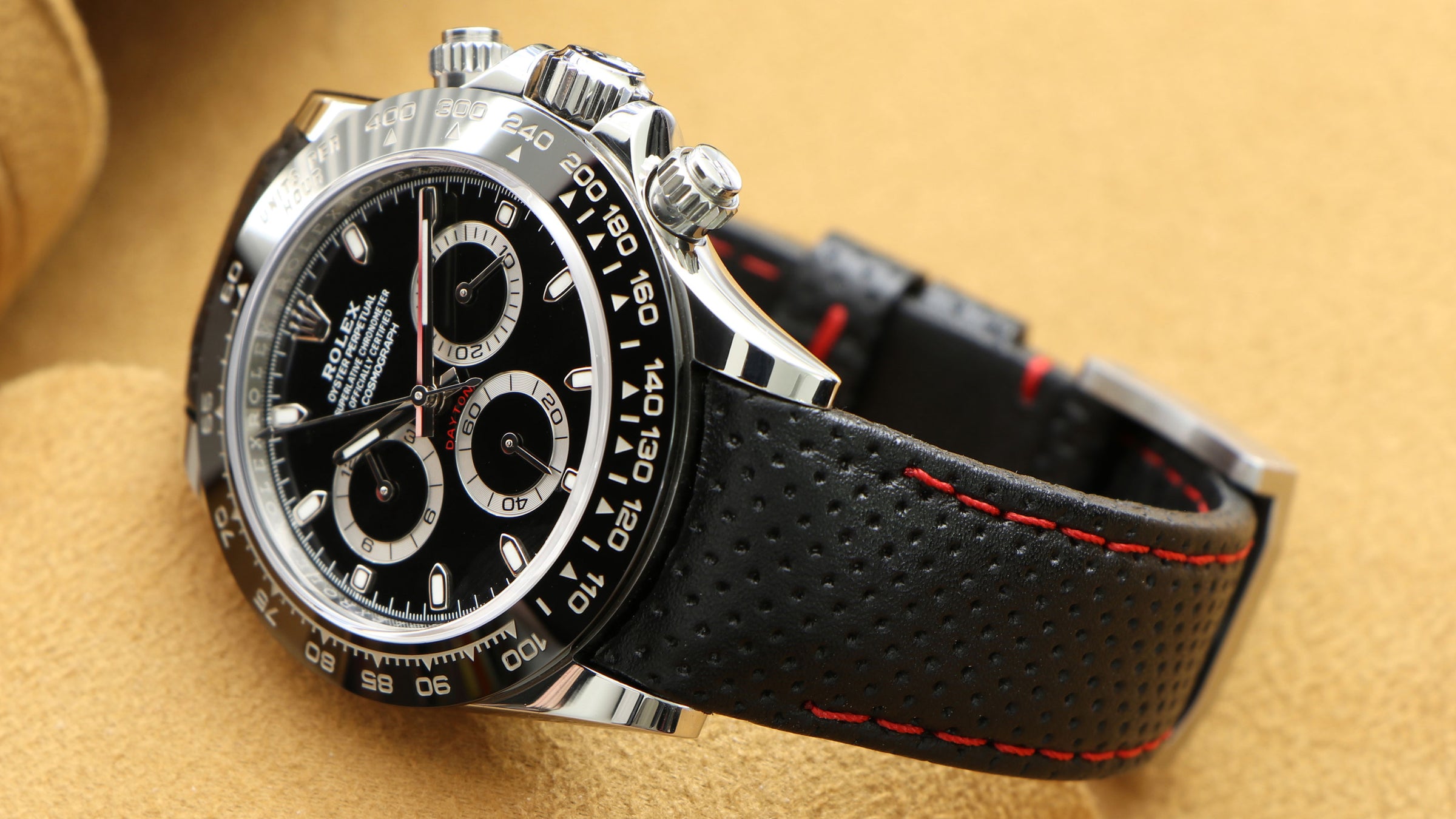 Perforated curved end Leather strap (black with red stitching) on Rolex Daytona